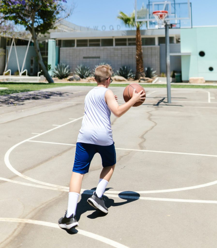Adolescence playing basketball