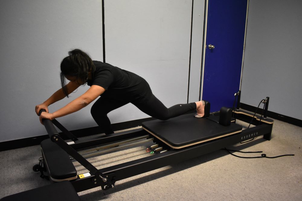 You are currently viewing The Remarkable Benefits of Reformer Pilates for Alleviating Low Back Pain