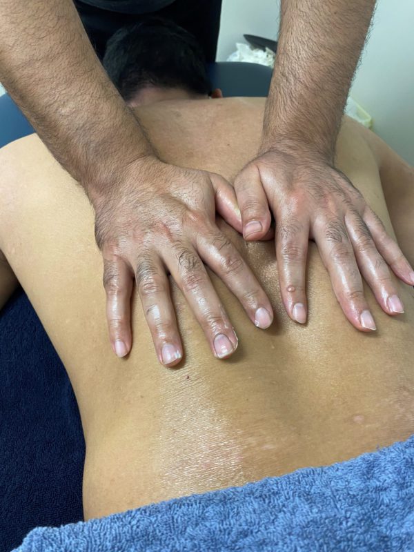 sourav massaging a patients back